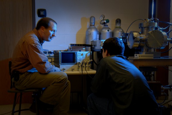 Nuclear engineering researcher and student in Burlington Labs lab. PHOTO BY ROGER WINSTEAD